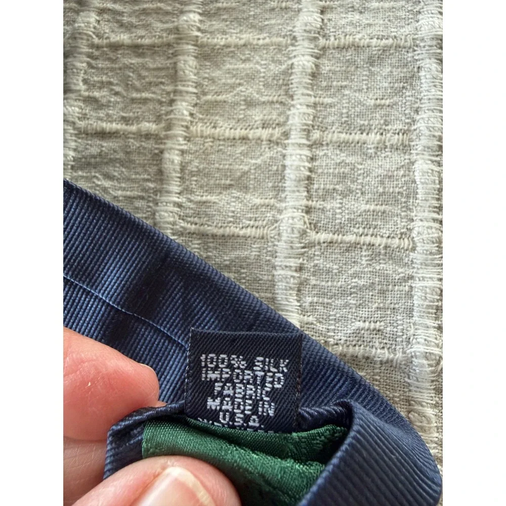90's Tommy Hilfiger navy blue crest silk neck tie, made in the USA